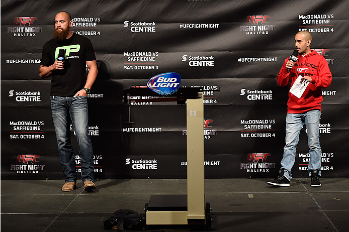HALIFAX, NS - OCTOBER 3: (L-R) Travis Browne and UFC announcer Jon Anik interact with fans during a Q&A session before the UFC Fight Night weigh-in at the Scotiabank Centre on October 3, 2014 in Halifax, Nova Scotia, Canada. (Photo by Jeff Bottari/Zuffa