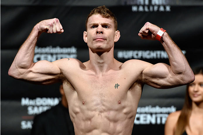 HALIFAX, NS - OCTOBER 3: Paul Felder of the United States steps on the scale during the UFC Fight Night weigh-in at the Scotiabank Centre on October 3, 2014 in Halifax, Nova Scotia, Canada. (Photo by Jeff Bottari/Zuffa LLC/Zuffa LLC via Getty Images)