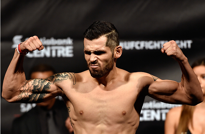 HALIFAX, NS - OCTOBER 3: Roman Salazar of the United States steps on the scale during the UFC Fight Night weigh-in at the Scotiabank Centre on October 3, 2014 in Halifax, Nova Scotia, Canada. (Photo by Jeff Bottari/Zuffa LLC/Zuffa LLC via Getty Images)