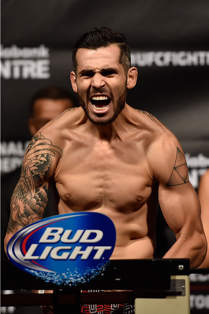 HALIFAX, NS - OCTOBER 3: Roman Salazar of the United States steps on the scale during the UFC Fight Night weigh-in at the Scotiabank Centre on October 3, 2014 in Halifax, Nova Scotia, Canada. (Photo by Jeff Bottari/Zuffa LLC/Zuffa LLC via Getty Images)