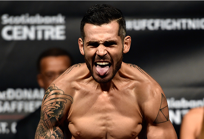 HALIFAX, NS - OCTOBER 3: Roman Salazar of the United States steps on the scale during the UFC Fight Night weigh-in at the Scotiabank Centre on October 3, 2014 in Halifax, Nova Scotia, Canada. (Photo by Jeff Bottari/Zuffa LLC/Zuffa LLC via Getty Images)