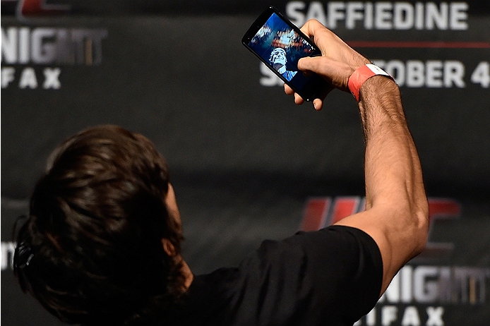 HALIFAX, NS - OCTOBER 3: Elias Theodorou of Canada takes a selfie onstage during the UFC Fight Night weigh-in at the Scotiabank Centre on October 3, 2014 in Halifax, Nova Scotia, Canada. (Photo by Jeff Bottari/Zuffa LLC/Zuffa LLC via Getty Images)