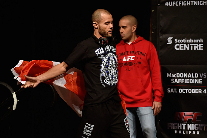 HALIFAX, NS - OCTOBER 3: Chad Laprise of Canada walks onstage with the Canadian flag during the UFC Fight Night weigh-in at the Scotiabank Centre on October 3, 2014 in Halifax, Nova Scotia, Canada. (Photo by Jeff Bottari/Zuffa LLC/Zuffa LLC via Getty Ima