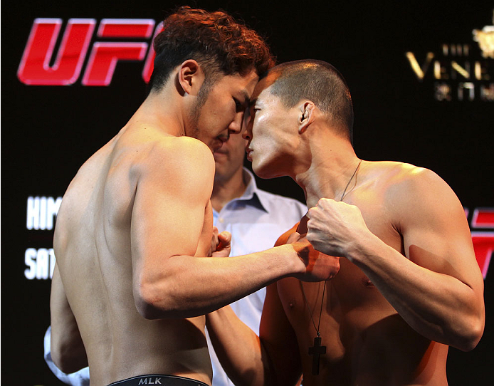 MACAU - FEBRUARY 28: (L and R) Kazuki Tokudome and Yui Chul Nam face off during the UFC weigh-in event at the Venetian Macau on February 28, 2014 in Macau. (Photo by Mitch Viquez/Zuffa LLC/Zuffa LLC via Getty Images)
