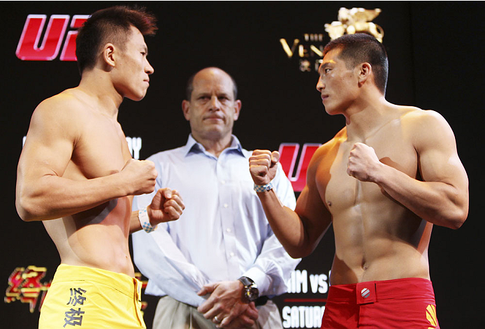 MACAU - FEBRUARY 28: (L and R) Wang Sai and Zhang Lipeng face off during the UFC weigh-in event at the Venetian Macau on February 28, 2014 in Macau. (Photo by Mitch Viquez/Zuffa LLC/Zuffa LLC via Getty Images)