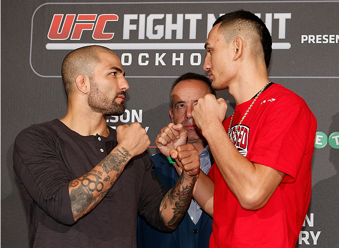 STOCKHOLM, SWEDEN - OCTOBER 01: (L-R) Opponents Akira Corassani of Sweden and Max Holloway face off at the Grand Hotel on October 1, 2014 in Stockholm, Sweden. (Photo by Josh Hedges/Zuffa LLC/Zuffa LLC via Getty Images)