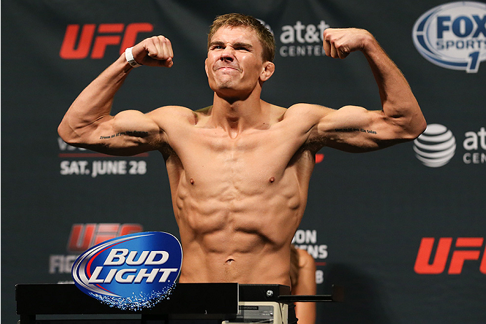 SAN ANTONIO, TX - JUNE 27: Cody Gibson steps on the scale during the UFC Fight Night weigh-in at the AT&T Center on June 27, 2014 in San Antonio, Texas. (Photo by Ed Mulholland/Zuffa LLC/Zuffa LLC via Getty Images)