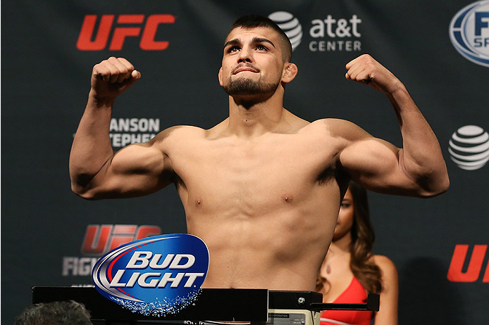 SAN ANTONIO, TX - JUNE 27: Kelvin Gastelum steps on the scale during the UFC Fight Night weigh-in at the AT&T Center on June 27, 2014 in San Antonio, Texas. (Photo by Ed Mulholland/Zuffa LLC/Zuffa LLC via Getty Images)