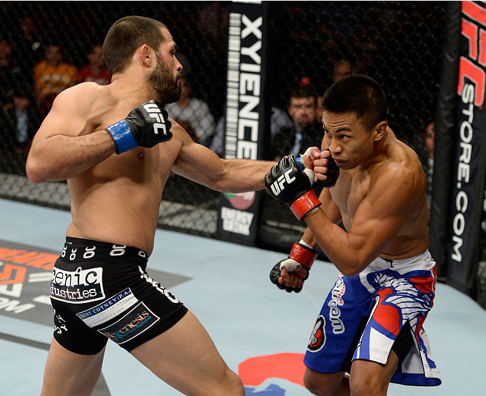 BANGOR, ME - AUGUST 16: (L-R) Frankie Saenz punches Nolan Ticman in their bantamweight bout during the UFC fight night event at the Cross Insurance Center on August 16, 2014 in Bangor, Maine. (Photo by Jeff Bottari/Zuffa LLC/Zuffa LLC via Getty Images)
