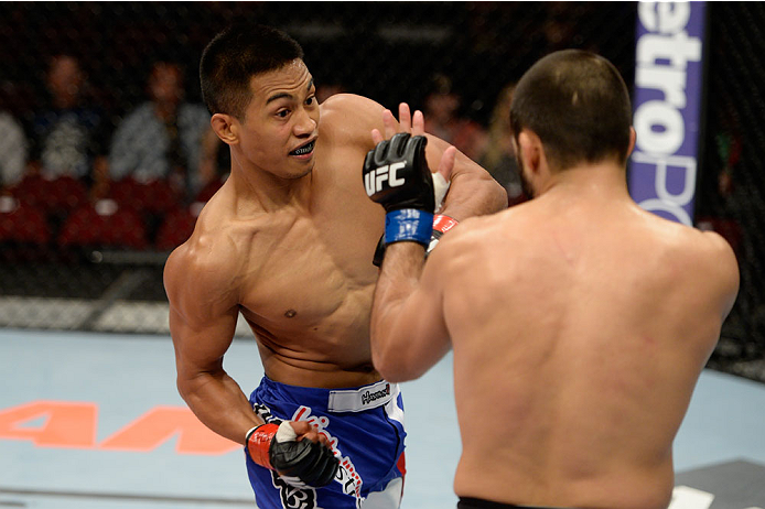 BANGOR, ME - AUGUST 16: (L-R) Nolan Ticman punches Frankie Saenz in their bantamweight bout during the UFC fight night event at the Cross Insurance Center on August 16, 2014 in Bangor, Maine. (Photo by Jeff Bottari/Zuffa LLC/Zuffa LLC via Getty Images)