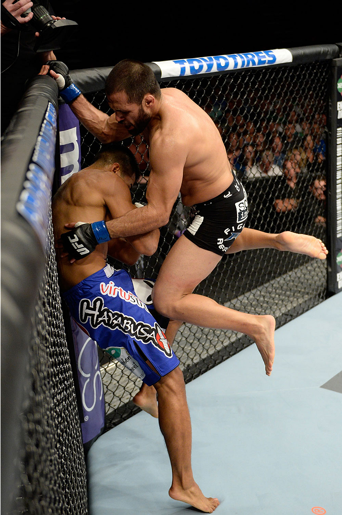 BANGOR, ME - AUGUST 16: (R-L) Frankie Saenz lands a flying knee to the body of Nolan Ticman in their bantamweight bout during the UFC fight night event at the Cross Insurance Center on August 16, 2014 in Bangor, Maine. (Photo by Jeff Bottari/Zuffa LLC/Zu