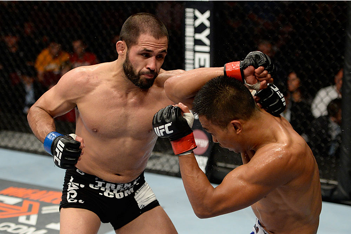 BANGOR, ME - AUGUST 16: (L-R) Frankie Saenz punches Nolan Ticman in their bantamweight bout during the UFC fight night event at the Cross Insurance Center on August 16, 2014 in Bangor, Maine. (Photo by Jeff Bottari/Zuffa LLC/Zuffa LLC via Getty Images)