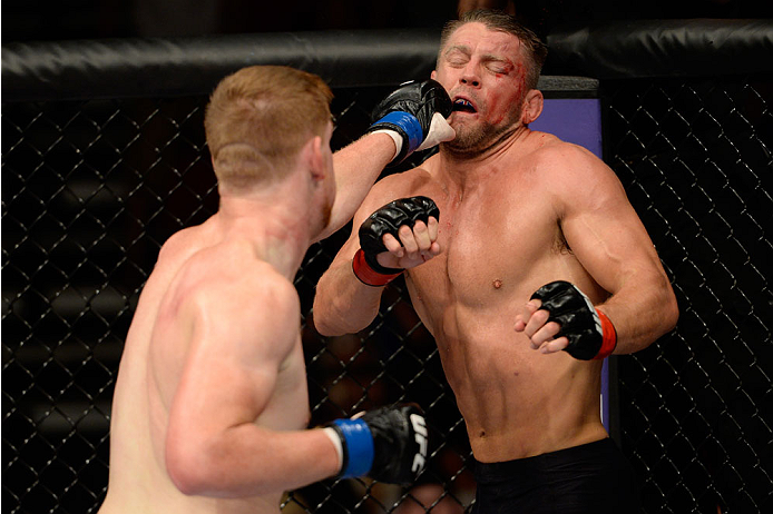 BANGOR, ME - AUGUST 16: (L-R) Sam Alvey punches Tom Watson in their middleweight bout during the UFC fight night event at the Cross Insurance Center on August 16, 2014 in Bangor, Maine. (Photo by Jeff Bottari/Zuffa LLC/Zuffa LLC via Getty Images)