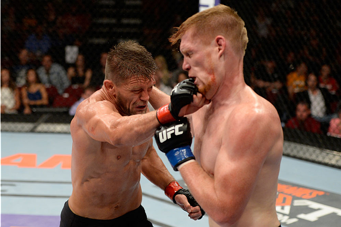 BANGOR, ME - AUGUST 16: (L-R) Tom Watson punches Sam Alvey in their middleweight bout during the UFC fight night event at the Cross Insurance Center on August 16, 2014 in Bangor, Maine. (Photo by Jeff Bottari/Zuffa LLC/Zuffa LLC via Getty Images)