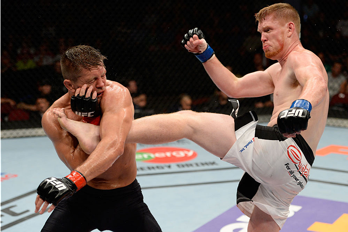 BANGOR, ME - AUGUST 16: (R-L) Sam Alvey kicks Tom Watson in their middleweight bout during the UFC fight night event at the Cross Insurance Center on August 16, 2014 in Bangor, Maine. (Photo by Jeff Bottari/Zuffa LLC/Zuffa LLC via Getty Images)