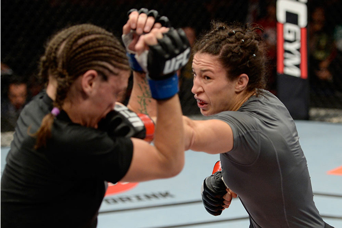 BANGOR, ME - AUGUST 16: (R-L) Sara McMann punches Lauren Murphy in their women's bantamweight bout during the UFC fight night event at the Cross Insurance Center on August 16, 2014 in Bangor, Maine. (Photo by Jeff Bottari/Zuffa LLC/Zuffa LLC via Getty Im