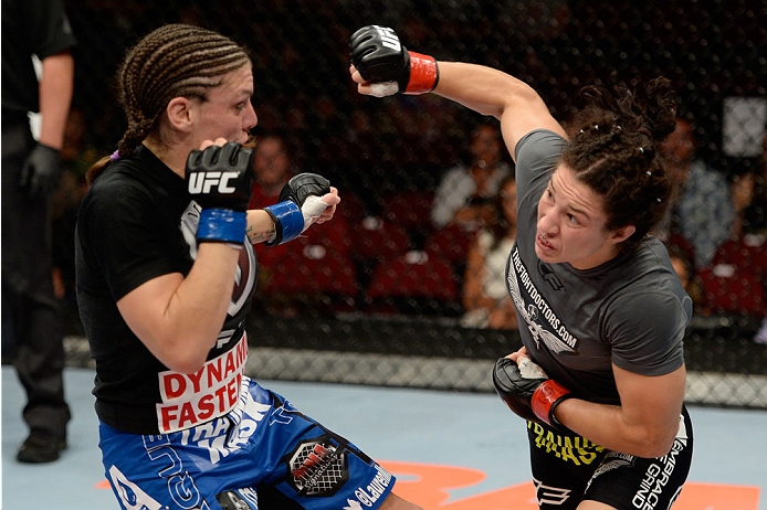 BANGOR, ME - AUGUST 16: (R-L) Sara McMann punches Lauren Murphy in their women's bantamweight bout during the UFC fight night event at the Cross Insurance Center on August 16, 2014 in Bangor, Maine. (Photo by Jeff Bottari/Zuffa LLC/Zuffa LLC via Getty Im