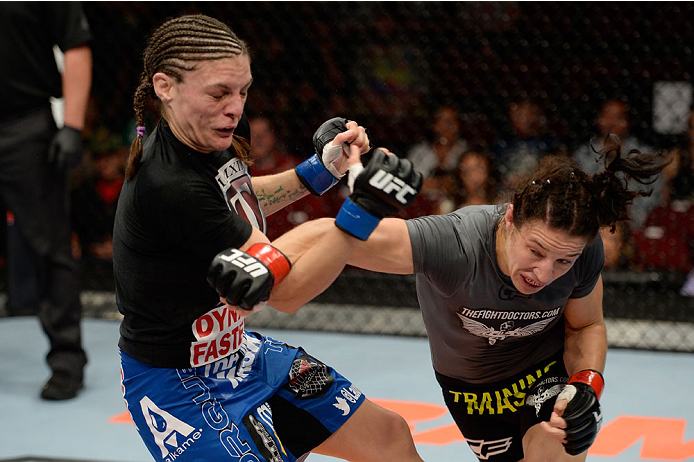 BANGOR, ME - AUGUST 16: (R-L) Sara McMann punches Lauren Murphy in their women's bantamweight bout during the UFC fight night event at the Cross Insurance Center on August 16, 2014 in Bangor, Maine. (Photo by Jeff Bottari/Zuffa LLC/Zuffa LLC via Getty Im