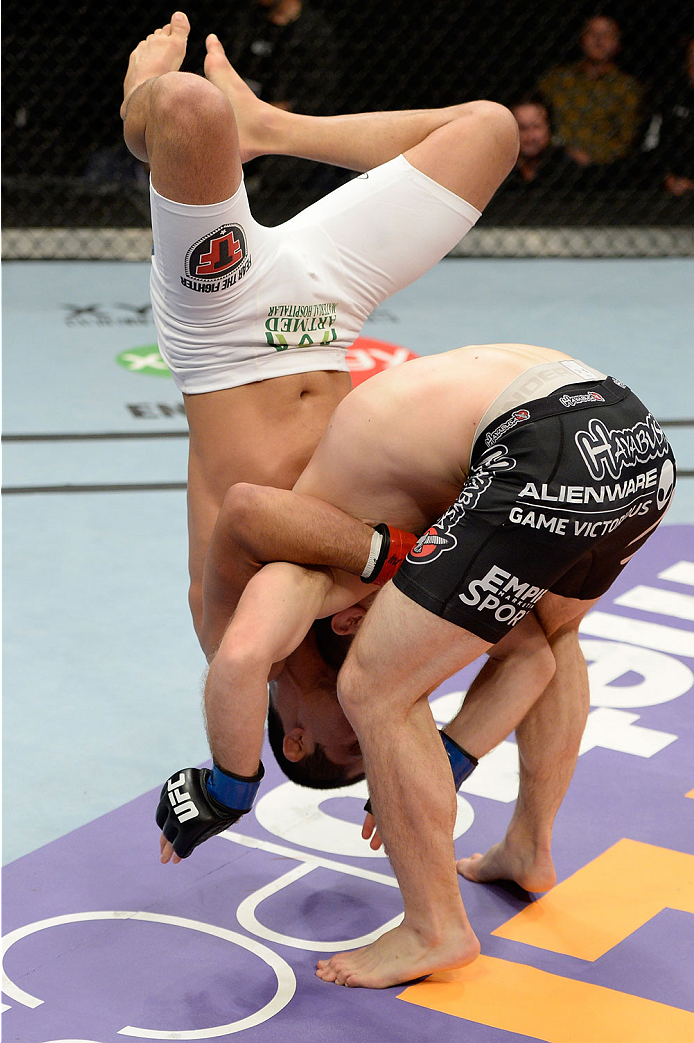 BANGOR, ME - AUGUST 16: (L-R) Jussier Formiga attempts to takedown Zach Makovsky in their flyweight bout during the UFC fight night event at the Cross Insurance Center on August 16, 2014 in Bangor, Maine. (Photo by Jeff Bottari/Zuffa LLC/Zuffa LLC via Ge