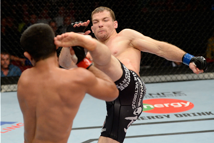BANGOR, ME - AUGUST 16: (R-L) Zach Makovsky kicks Jussier Formiga in their flyweight bout during the UFC fight night event at the Cross Insurance Center on August 16, 2014 in Bangor, Maine. (Photo by Jeff Bottari/Zuffa LLC/Zuffa LLC via Getty Images)