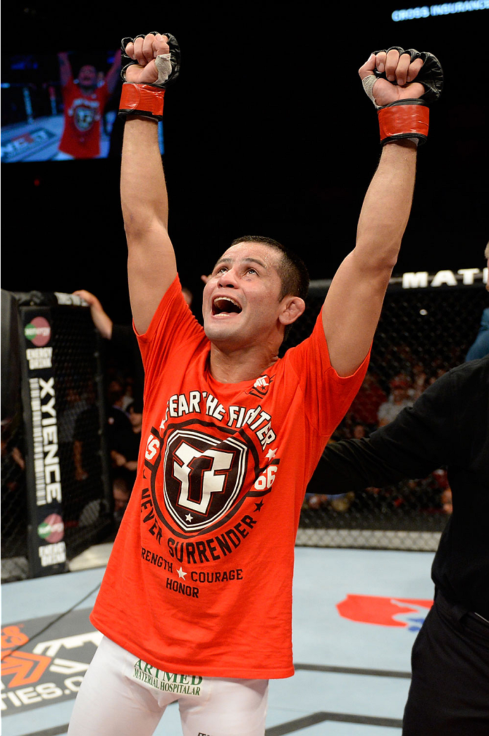 BANGOR, ME - AUGUST 16: Jussier Formiga celebrates the split decision win over Zach Makovsky in their flyweight bout during the UFC fight night event at the Cross Insurance Center on August 16, 2014 in Bangor, Maine. (Photo by Jeff Bottari/Zuffa LLC/Zuff