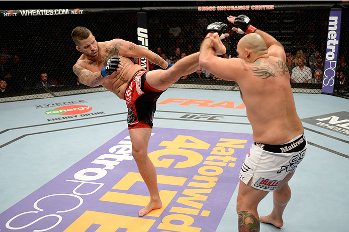 BANGOR, ME - AUGUST 16: (L-R) Jack May kicks Shawn Jordan in their heavyweight bout during the UFC fight night event at the Cross Insurance Center on August 16, 2014 in Bangor, Maine. (Photo by Jeff Bottari/Zuffa LLC/Zuffa LLC via Getty Images)