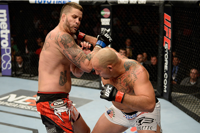 BANGOR, ME - AUGUST 16: (R-L) Shawn Jordan punches Jack May in their heavyweight bout during the UFC fight night event at the Cross Insurance Center on August 16, 2014 in Bangor, Maine. (Photo by Jeff Bottari/Zuffa LLC/Zuffa LLC via Getty Images)