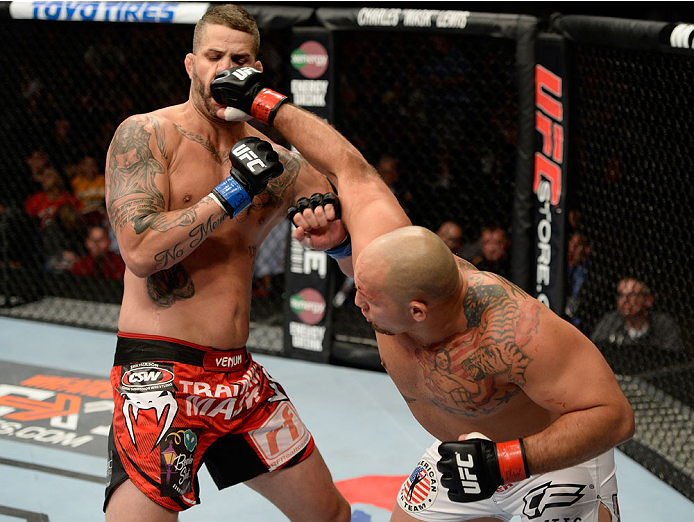 BANGOR, ME - AUGUST 16: (R-L) Shawn Jordan punches Jack May in their heavyweight bout during the UFC fight night event at the Cross Insurance Center on August 16, 2014 in Bangor, Maine. (Photo by Jeff Bottari/Zuffa LLC/Zuffa LLC via Getty Images)
