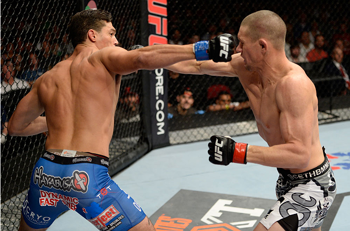 BANGOR, ME - AUGUST 16: (L-R) Alan Jouban punches Seth Baczynski in their welterweight bout during the UFC fight night event at the Cross Insurance Center on August 16, 2014 in Bangor, Maine. (Photo by Jeff Bottari/Zuffa LLC/Zuffa LLC via Getty Images)