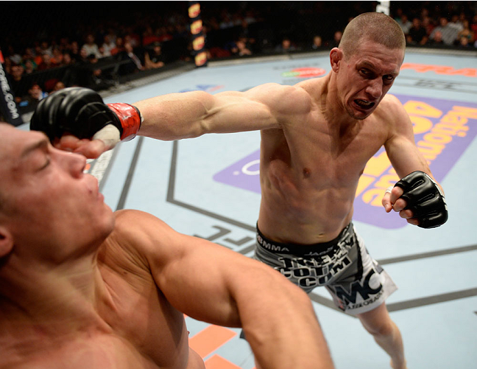 BANGOR, ME - AUGUST 16: (R-L) Seth Baczynski punches Alan Jouban in their welterweight bout during the UFC fight night event at the Cross Insurance Center on August 16, 2014 in Bangor, Maine. (Photo by Jeff Bottari/Zuffa LLC/Zuffa LLC via Getty Images)