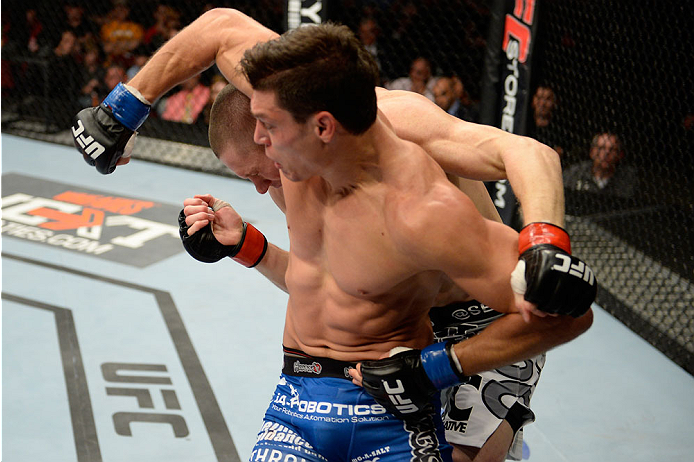 BANGOR, ME - AUGUST 16: (L-R) Alan Jouban elbows Seth Baczynski in their welterweight bout during the UFC fight night event at the Cross Insurance Center on August 16, 2014 in Bangor, Maine. (Photo by Jeff Bottari/Zuffa LLC/Zuffa LLC via Getty Images)