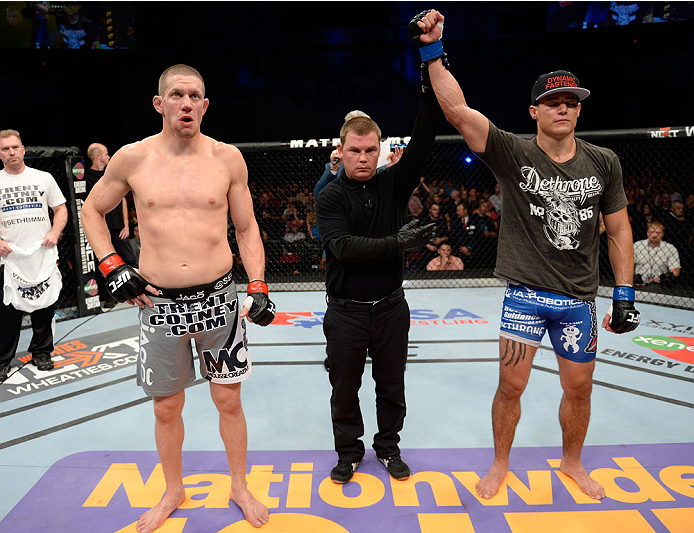BANGOR, ME - AUGUST 16: (R-L) Alan Jouban celebrates after knocking out Seth Baczynski in their welterweight bout during the UFC fight night event at the Cross Insurance Center on August 16, 2014 in Bangor, Maine. (Photo by Jeff Bottari/Zuffa LLC/Zuffa L