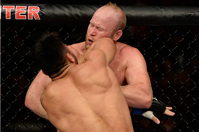BANGOR, ME - AUGUST 16: (L-R) Brad Tavares lands an elbow to the head of Tim Boetsch in their middleweight bout during the UFC fight night event at the Cross Insurance Center on August 16, 2014 in Bangor, Maine. (Photo by Jeff Bottari/Zuffa LLC/Zuffa LLC