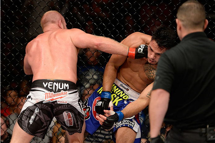 BANGOR, ME - AUGUST 16: (L-R) Tim Boetsch knocks out Brad Tavares in their middleweight bout during the UFC fight night event at the Cross Insurance Center on August 16, 2014 in Bangor, Maine. (Photo by Jeff Bottari/Zuffa LLC/Zuffa LLC via Getty Images)
