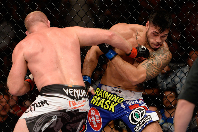 BANGOR, ME - AUGUST 16: (L-R) Tim Boetsch knocks out Brad Tavares in their middleweight bout during the UFC fight night event at the Cross Insurance Center on August 16, 2014 in Bangor, Maine. (Photo by Jeff Bottari/Zuffa LLC/Zuffa LLC via Getty Images)