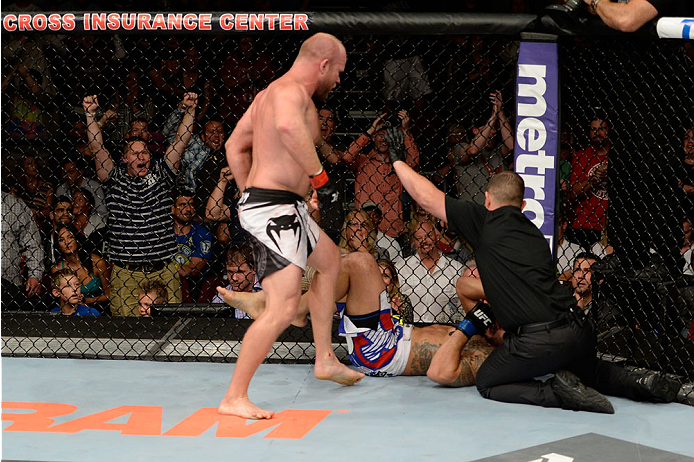 BANGOR, ME - AUGUST 16: (L-R) Tim Boetsch knocks out Brad Tavares in their middleweight bout during the UFC fight night event at the Cross Insurance Center on August 16, 2014 in Bangor, Maine. (Photo by Jeff Bottari/Zuffa LLC/Zuffa LLC via Getty Images)