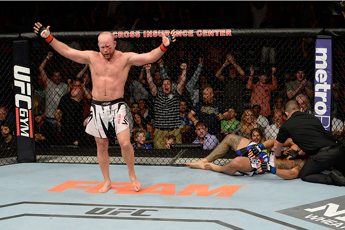 BANGOR, ME - AUGUST 16: (L-R) Tim Boetsch celebrates after knocking out Brad Tavares in their middleweight bout during the UFC fight night event at the Cross Insurance Center on August 16, 2014 in Bangor, Maine. (Photo by Jeff Bottari/Zuffa LLC/Zuffa LLC