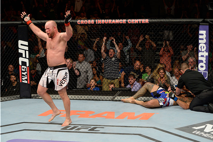 BANGOR, ME - AUGUST 16: (L-R) Tim Boetsch celebrates after knocking out Brad Tavares in their middleweight bout during the UFC fight night event at the Cross Insurance Center on August 16, 2014 in Bangor, Maine. (Photo by Jeff Bottari/Zuffa LLC/Zuffa LLC