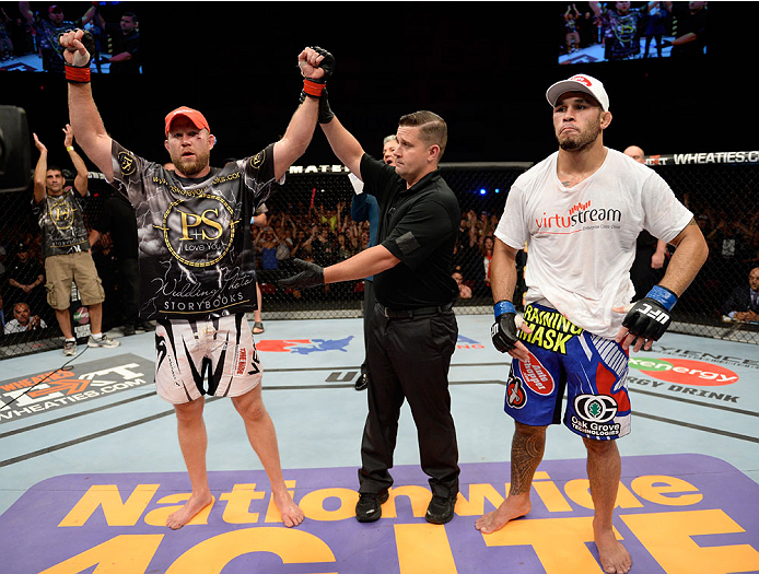 BANGOR, ME - AUGUST 16: (L-R) Tim Boetsch celebrates after defeating Brad Tavares in their middleweight bout during the UFC fight night event at the Cross Insurance Center on August 16, 2014 in Bangor, Maine. (Photo by Jeff Bottari/Zuffa LLC/Zuffa LLC vi