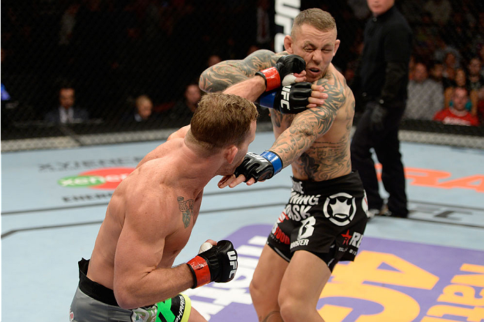 BANGOR, ME - AUGUST 16: (L-R) Gray Maynard punches Ross Pearson in their lightweight bout during the UFC fight night event at the Cross Insurance Center on August 16, 2014 in Bangor, Maine. (Photo by Jeff Bottari/Zuffa LLC/Zuffa LLC via Getty Images)