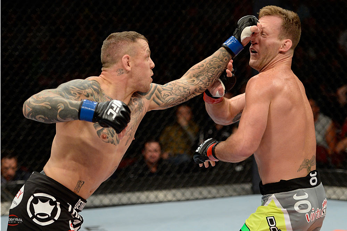 BANGOR, ME - AUGUST 16: (L-R) Ross Pearson punches Gray Maynard in their lightweight bout during the UFC fight night event at the Cross Insurance Center on August 16, 2014 in Bangor, Maine. (Photo by Jeff Bottari/Zuffa LLC/Zuffa LLC via Getty Images)