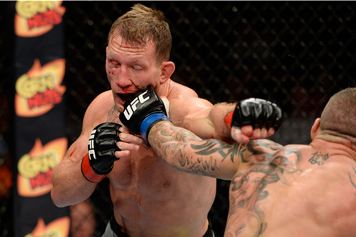 BANGOR, ME - AUGUST 16: (R-L) Ross Pearson punches Gray Maynard in their lightweight bout during the UFC fight night event at the Cross Insurance Center on August 16, 2014 in Bangor, Maine. (Photo by Jeff Bottari/Zuffa LLC/Zuffa LLC via Getty Images)