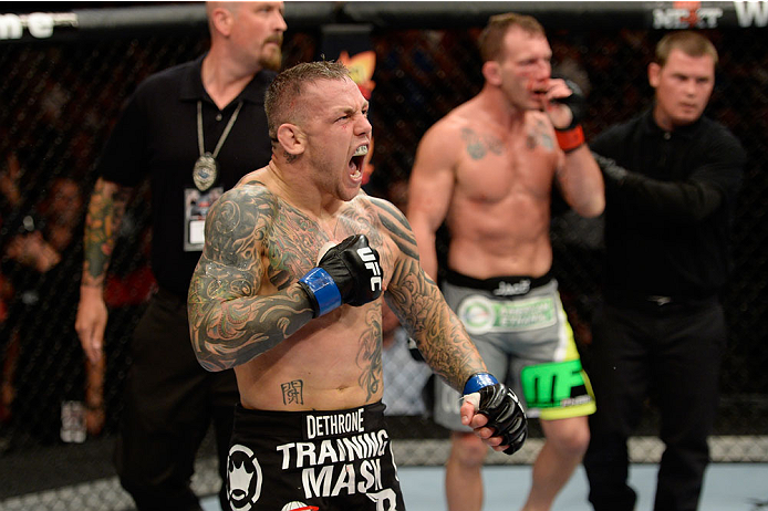 BANGOR, ME - AUGUST 16: (L-R) Ross Pearson celebrates after knocking out Gray Maynard in their lightweight bout during the UFC fight night event at the Cross Insurance Center on August 16, 2014 in Bangor, Maine. (Photo by Jeff Bottari/Zuffa LLC/Zuffa LLC