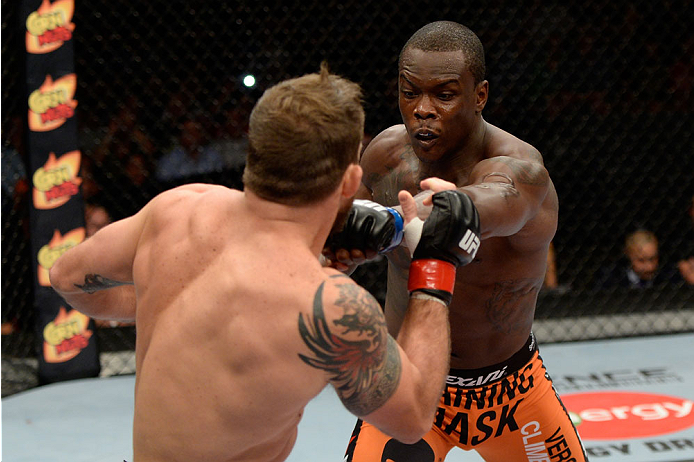 BANGOR, ME - AUGUST 16: (R-L) Ovince Saint Preux punches Ryan Bader in their light heavyweight bout during the UFC fight night event at the Cross Insurance Center on August 16, 2014 in Bangor, Maine. (Photo by Jeff Bottari/Zuffa LLC/Zuffa LLC via Getty I