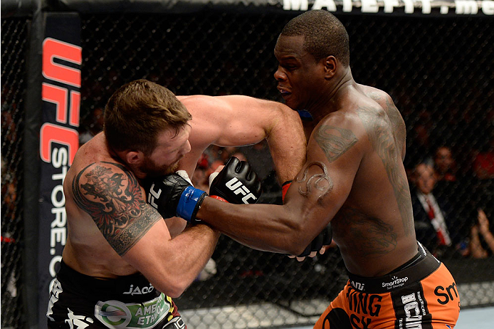 BANGOR, ME - AUGUST 16: (R-L) Ovince Saint Preux punches Ryan Bader in their light heavyweight bout during the UFC fight night event at the Cross Insurance Center on August 16, 2014 in Bangor, Maine. (Photo by Jeff Bottari/Zuffa LLC/Zuffa LLC via Getty I
