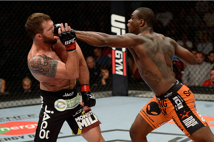 BANGOR, ME - AUGUST 16: (R-L) Ovince Saint Preux punches Ryan Bader in their light heavyweight bout during the UFC fight night event at the Cross Insurance Center on August 16, 2014 in Bangor, Maine. (Photo by Jeff Bottari/Zuffa LLC/Zuffa LLC via Getty I