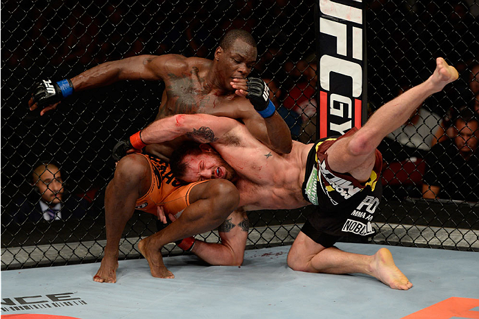 BANGOR, ME - AUGUST 16: (L-R) Ovince Saint Preux lands an elbow to the body of Ryan Bader in their light heavyweight bout during the UFC fight night event at the Cross Insurance Center on August 16, 2014 in Bangor, Maine. (Photo by Jeff Bottari/Zuffa LLC