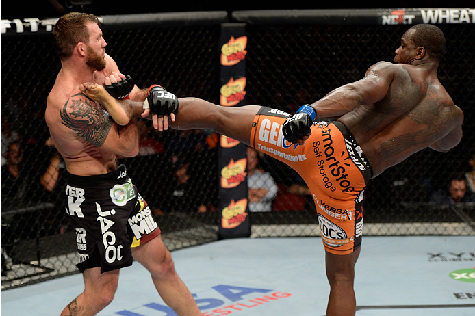 BANGOR, ME - AUGUST 16: (R-L) Ovince Saint Preux kicks Ryan Bader in their light heavyweight bout during the UFC fight night event at the Cross Insurance Center on August 16, 2014 in Bangor, Maine. (Photo by Jeff Bottari/Zuffa LLC/Zuffa LLC via Getty Ima