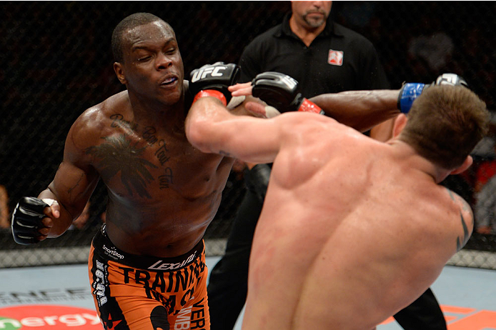 BANGOR, ME - AUGUST 16: (L-R) Ovince Saint Preux punches Ryan Bader in their light heavyweight bout during the UFC fight night event at the Cross Insurance Center on August 16, 2014 in Bangor, Maine. (Photo by Jeff Bottari/Zuffa LLC/Zuffa LLC via Getty I