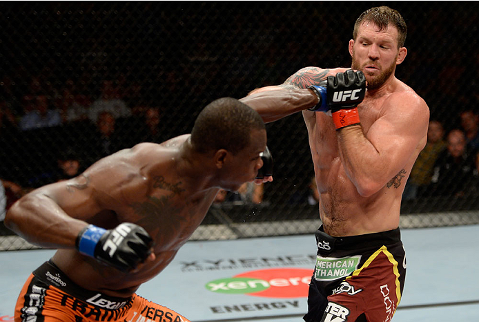 BANGOR, ME - AUGUST 16: (L-R) Ovince Saint Preux throws a punch at Ryan Bader in their light heavyweight bout during the UFC fight night event at the Cross Insurance Center on August 16, 2014 in Bangor, Maine. (Photo by Jeff Bottari/Zuffa LLC/Zuffa LLC v